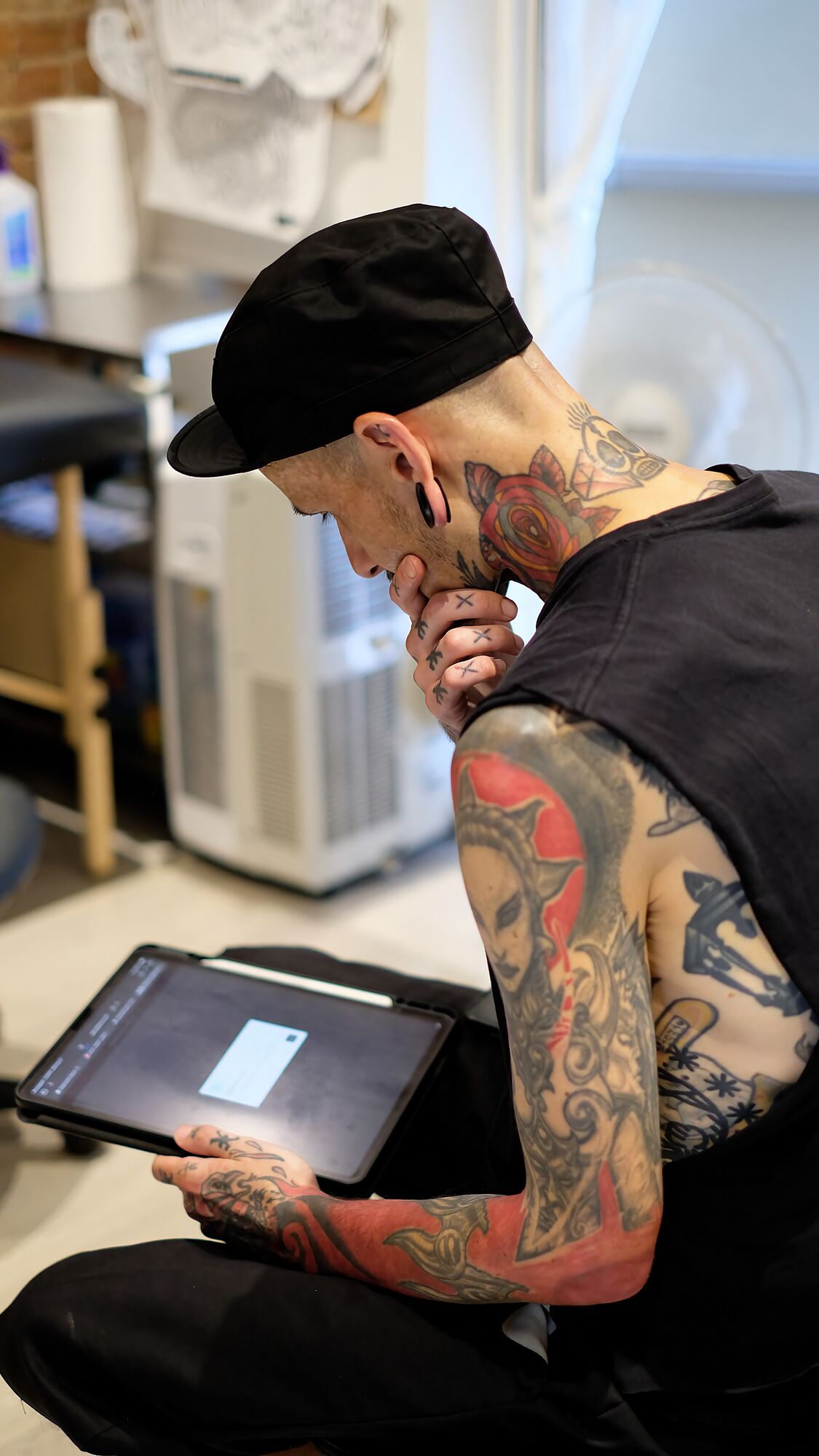 Christian Maheux looking at Inked Vice Yonge Street Tattoos Toronto x1506x