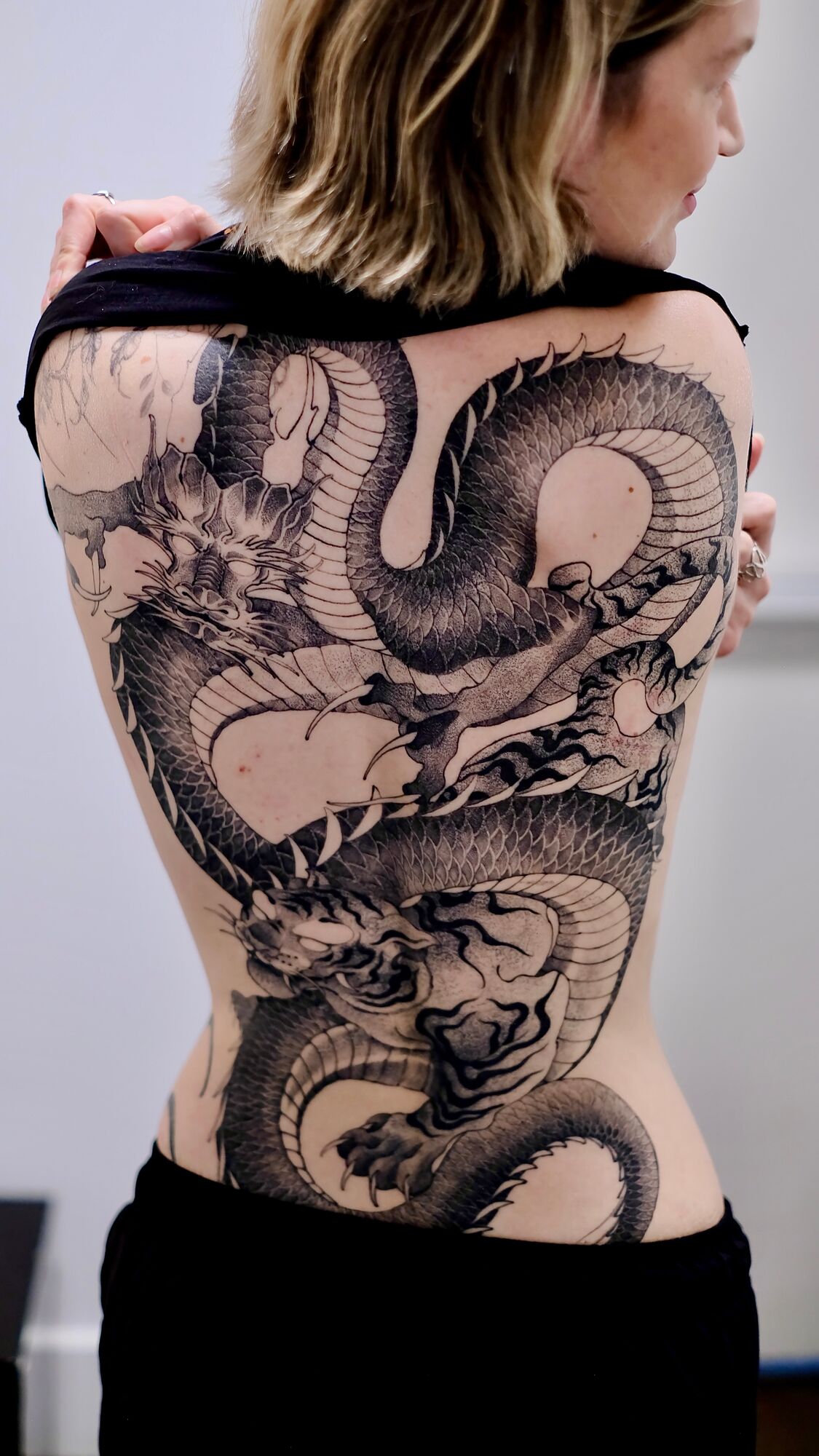 Back tattoo on Valeriia